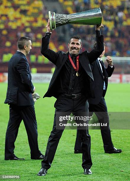 Atletico Madrid manager Diego Simeone lifts the UEFA Europa League trophy