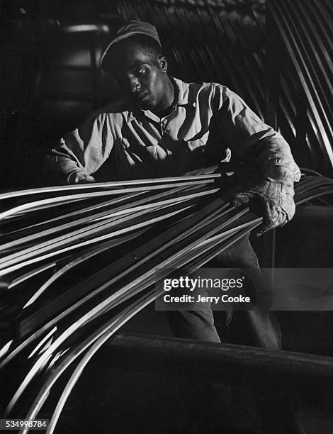 Assembly Worker at Chrysler Automobile Factory, circa 1945.