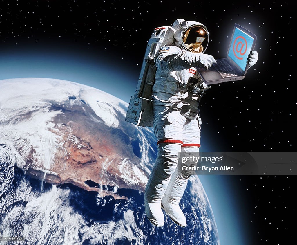 Astronaut Holding a Laptop