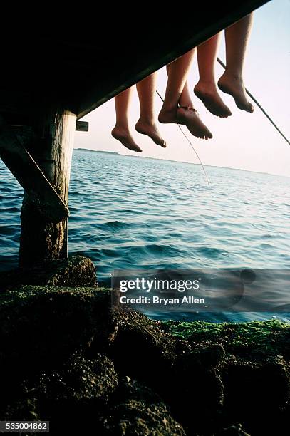 fishing feet - eternal youth stock pictures, royalty-free photos & images