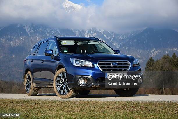 subaru outback on the road - subaru stock pictures, royalty-free photos & images