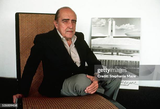 Brazilian architect Oscar Niemeyer with a photo of Rio de Janeiro's Sambadromo, a building he designed. Niemeyer was one of the chief architects who...