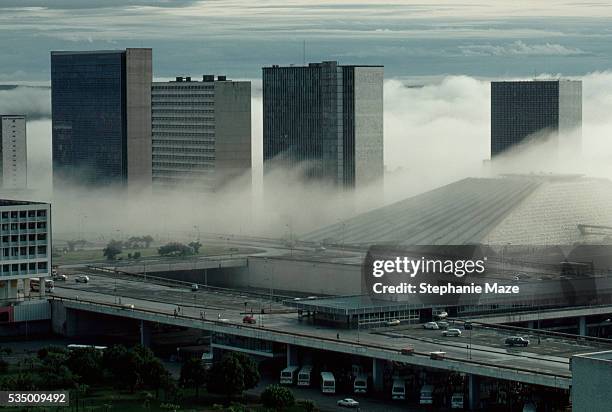 fog and downtown buildings in brasilia - brasília stock pictures, royalty-free photos & images