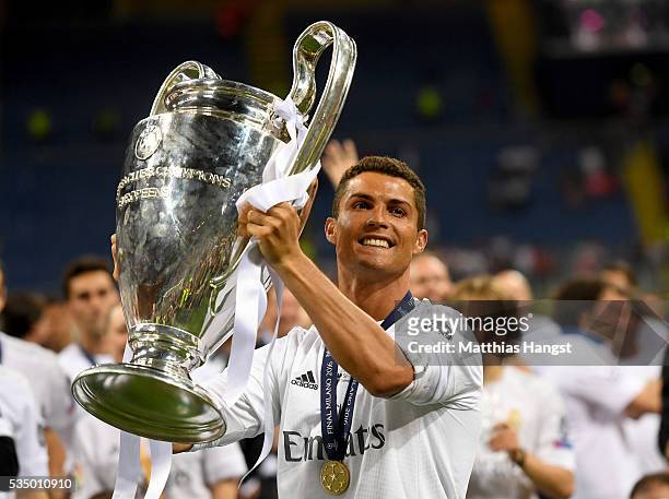 Cristiano Ronaldo of Real Madrid lifts the Champions League trophy after the UEFA Champions League Final match between Real Madrid and Club Atletico...