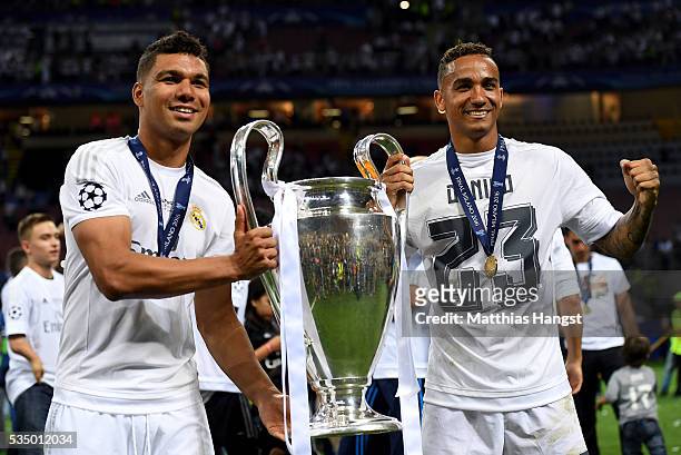 Casemiro and Danilo of Real Madrid pose with the trophy after winning the UEFA Champions League Final match between Real Madrid and Club Atletico de...