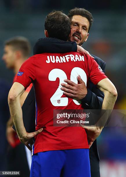 Club Atletico de Madrid head coach Diego Simeone hugs a desperate Juanfran after the UEFA Champions League Final match between Real Madrid and Club...