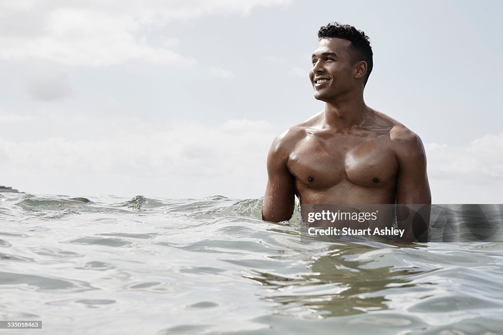 Happy male in coastal ocean