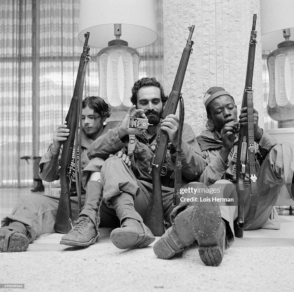 Cuban Rebel Soldiers Cleaning Their Rifles