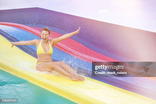 fun on water slide - waterpark stock pictures, royalty-free photos & images