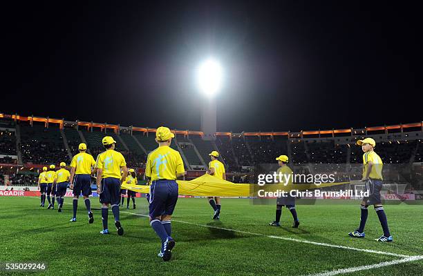 The FIFA mascots walk out ahead of kick-off