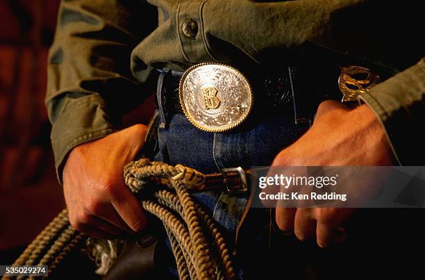 cowboy with b belt buckle and rope - schnalle stock-fotos und bilder