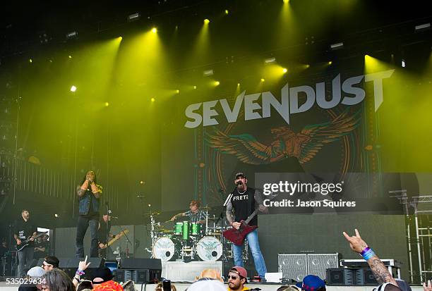 Musicians Lajon Witherspoon, Clint Lowery, John Connolly, Vince Hornsby, and Morgan Rose of Sevendust perform at Catch The Fever Festival Grounds on...