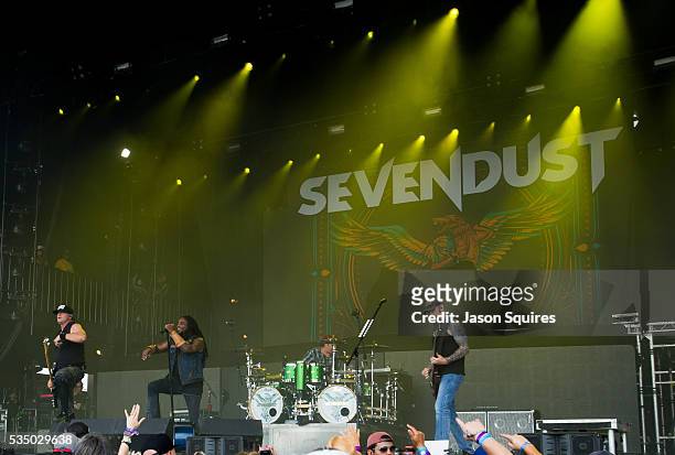 Musicians Lajon Witherspoon, Clint Lowery, John Connolly, Vince Hornsby, and Morgan Rose of Sevendust perform at Catch The Fever Festival Grounds on...