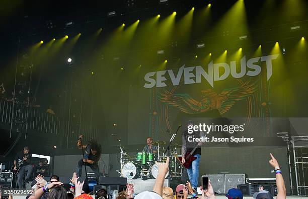 Musicians Lajon Witherspoon, Clint Lowery, John Connolly, Vince Hornsby, and Morgan Rose of Sevendust perform at Catch The Fever Festival Grounds on...