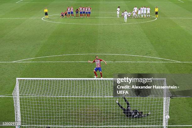 Keylor Navas of Real Madrid safes the penalty by Juanfran of Atletico Madrid during the UEFA Champions League Final between Real Madrid and Club...