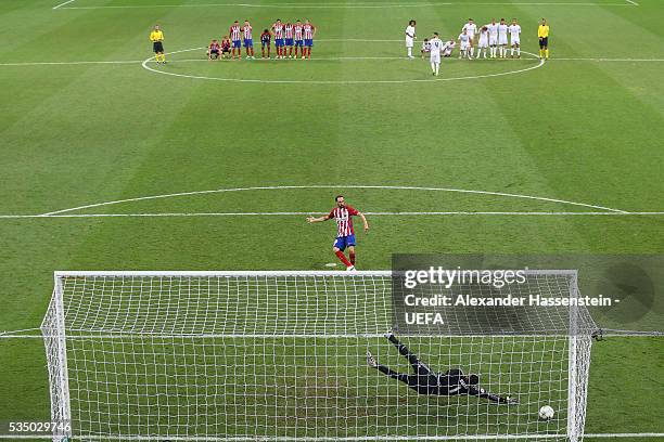 Keylor Navas of Real Madrid safes the penalty by Juanfran of Atletico Madrid during the UEFA Champions League Final between Real Madrid and Club...