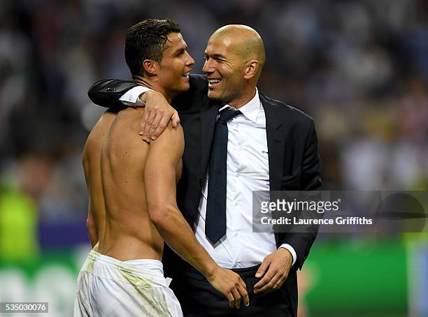 Real Madrid head coach Zinedine Zidane hugs a smiling Cristiano Ronaldo of Real Madrid after the UEFA Champions League Final match between Real...