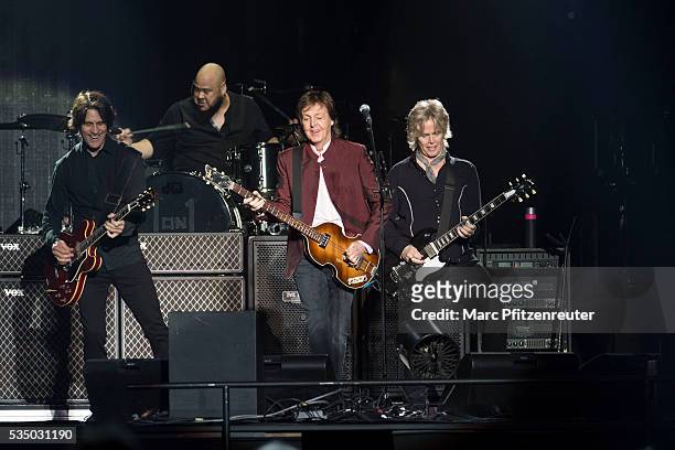 Rusty Anderson, Abe Laboriel, Jr., Paul McCartney and Brian Ray perform onstage during the 'One on One Tour' at the Esprit-Arena on May 28, 2016 in...