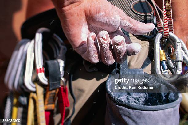 rock climber's hand - chalk bag stock-fotos und bilder