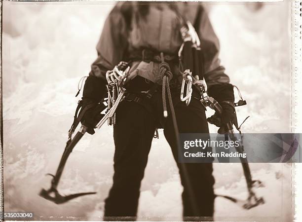 ice climber holding gear - vintage ice climbing gear stock pictures, royalty-free photos & images