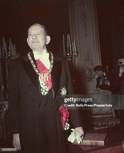 French politician and President of France, Rene Coty pictured wearing his presidential robes of office in January 1954.