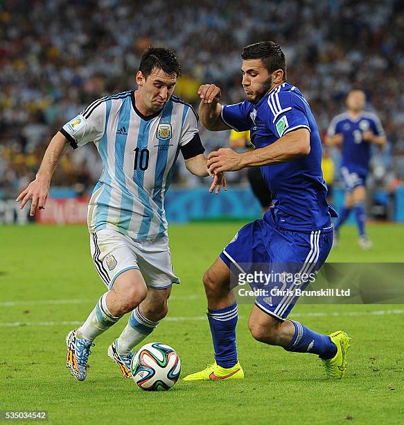 Lionel Messi of Argentina and Sead Kolasinac of Bosnia-Herzegovina