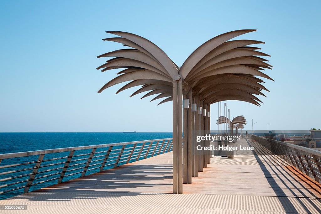 Palm tree shaped canopy on pier