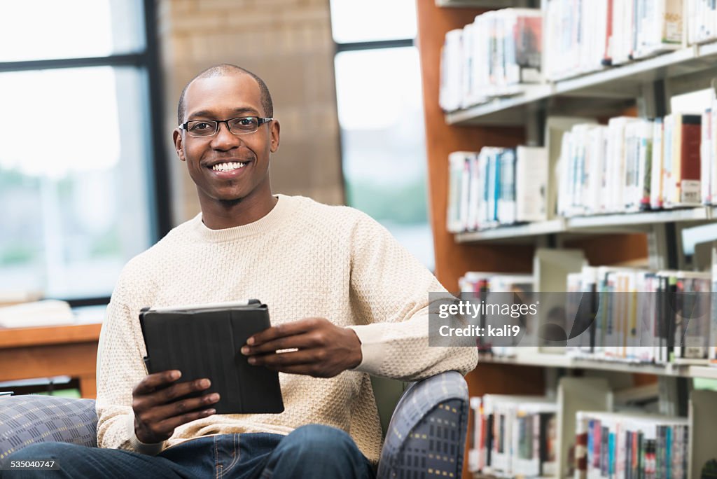 Young African American man in the library