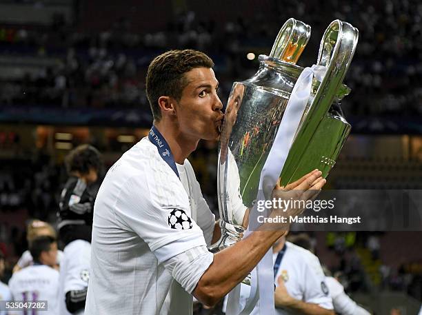 Cristiano Ronaldo of Real Madrid kisses the trophy after winning the UEFA Champions League Final match between Real Madrid and Club Atletico de...