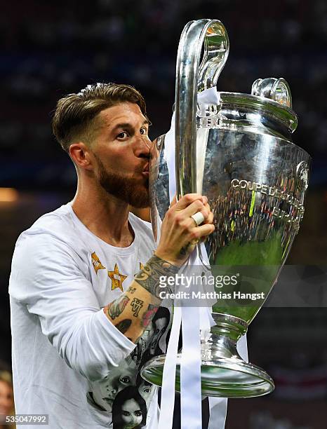 Sergio Ramos of Real Madrid kisses the trophy after winning the UEFA Champions League Final match between Real Madrid and Club Atletico de Madrid at...
