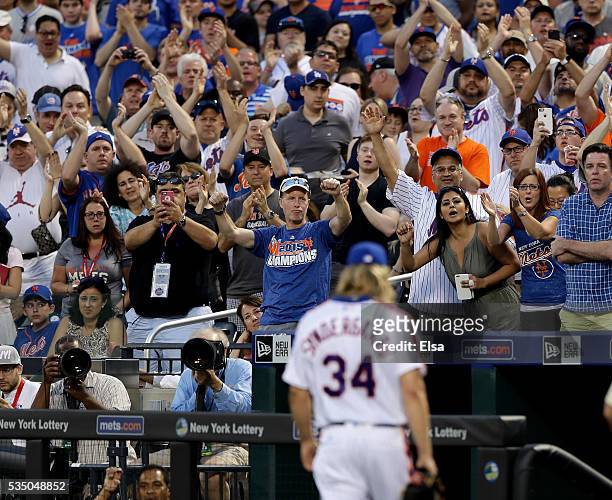 Fans cheer for Noah Syndergaard of the New York Mets after he was tossed from the game for brushing back Chase Utley of the Los Angeles Dodgers in...
