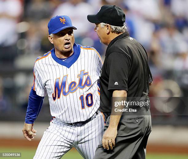 Manager Terry Collins of the New York Mets argues with officials after Noah Syndergaard of the Mets is thrown out of the game for brushing back Chase...