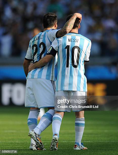 Lionel Messi of Argentina is congratulated by team-mate Ezequiel Lavezzi after scoring the opening goal