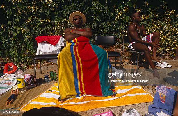 During an August heat wave, the population of Brixton and many others from all over London, bask in the glorious weather at the Brockwell Lido in...