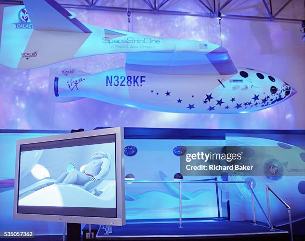 Computer-generated astronaut lies down on board a space flight on Virgin Galactic's SpaceShipTwo's, unveiled as a replica model during Wired NextFest...