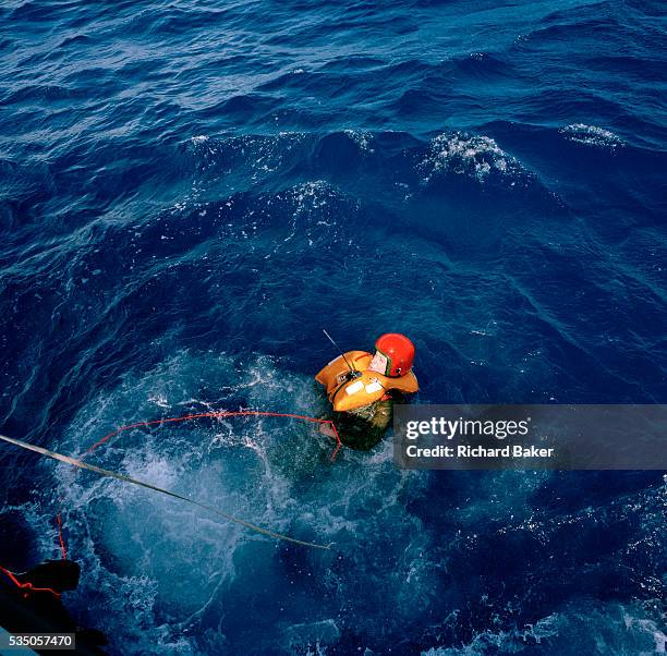 In a red helmet, Squadron Leader Spike Jepson, team leader of the elite 'Red Arrows', Britain's prestigious Royal Air Force aerobatic team, plunges...