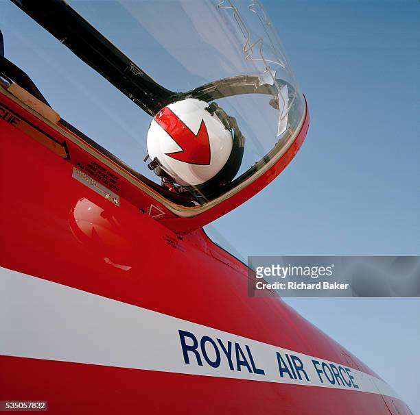 Flying helmet belonging to a member of the elite 'Red Arrows', Britain's prestigious Royal Air Force aerobatic team, is cradled in the...