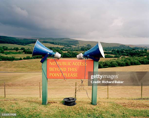 An old fashioned pair of public address speakers have been attached to a no access sign overlooking the Northumberland countryside at the Kielder Air...