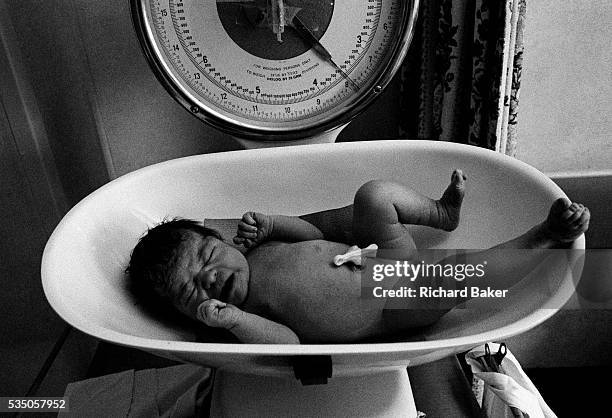 7lbs 13oz. On a labour ward at Kings College Hospital, London, a new-born baby girl has been temporarily separated from her mother and placed...