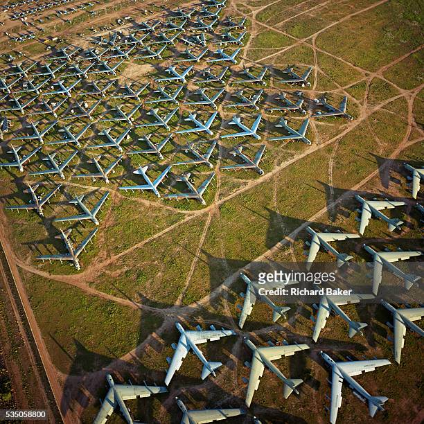 Seen from the air at dawn, the last remaining B-52 bombers from the Cold War-era are laid out in grids in their graveyard across the arid desert near...