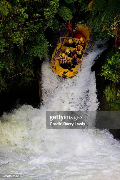 New Zealand North Island, Rotorua area. White water rafting on the Kaituna river in yellow inflatable boat