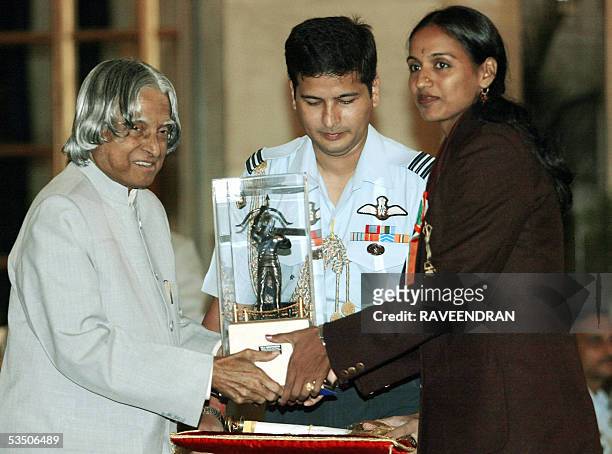 Indian athlete J.J. Shobha receives the prestigious Arjuna Award, from Indian President A.P.J. Abdul Kalam at a sports and adventure awards function...