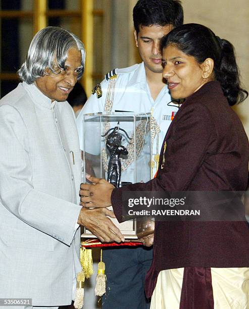 Indian shooter, Deepali A. Deshpande, silver medal winner at the 2004 Asian Shooting Championships, receives the prestigious Arjuna Award, from...