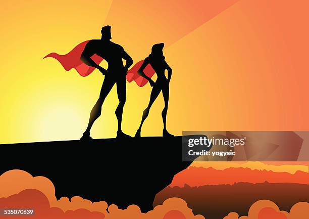 vector superhero couple in silhouette - superhero shadow stock illustrations