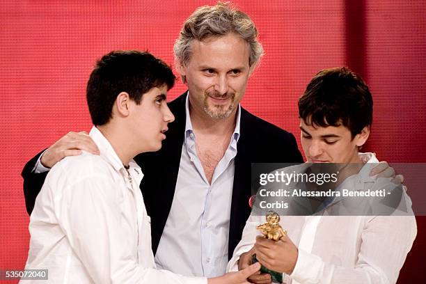 Italian director Cristiano Bortone and actors Francesco Capobasso and Luca Capriotti hold their David di Donatello award, received in the "Young"...