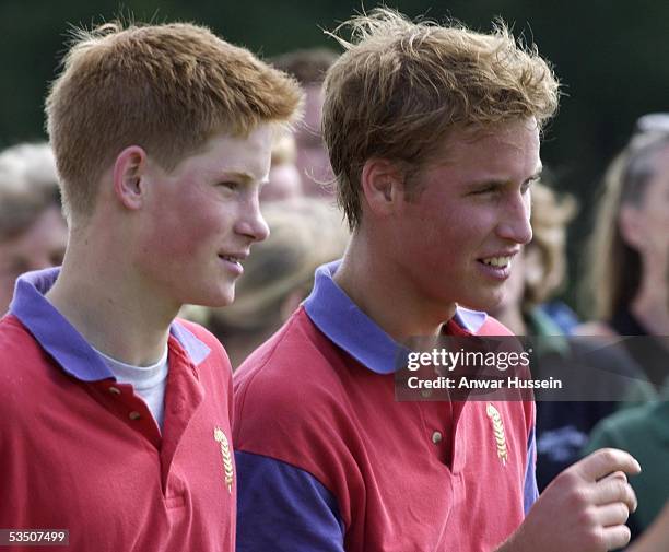 Prince William and Prince Harry attend a polo match at Cirencester Park in July, 2001 in Cirencester, England.