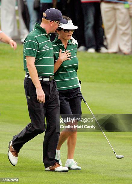 Celebrity golfer Chris Evans comforts Catherine Zeta-Jones after fluffing her first shot on the final day of The All-Star Cup Celebrity Golf...