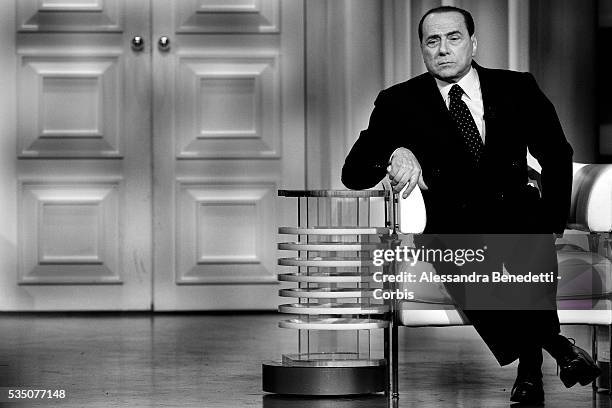 Silvio Berlusconi, leader of Italy's center-right coalition Forza Italia, attends the Italian political debate show Porta a Porta, at Rai's broadcast...