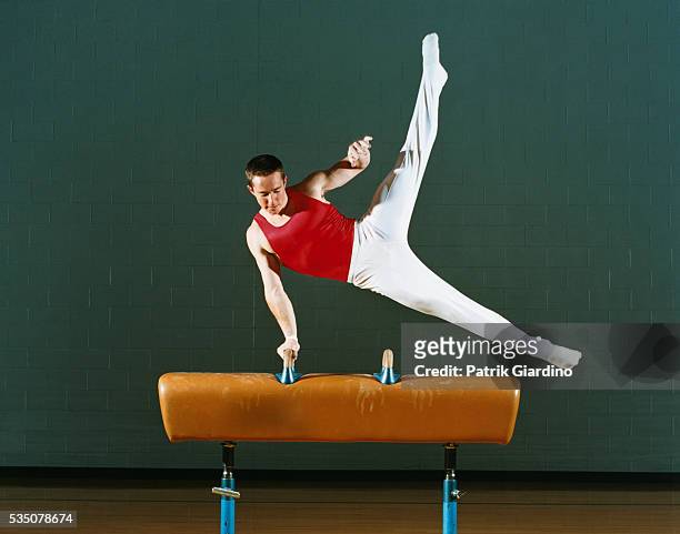 gymnast performing on pommel horse - pommel horse bildbanksfoton och bilder