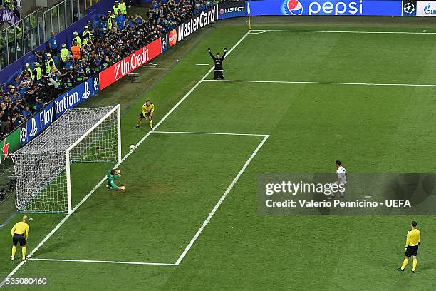 Cristiano Ronaldo of Real Madrid scores the goal of the victory during the UEFA Champions League Final between Real Madrid and Club Atletico de...